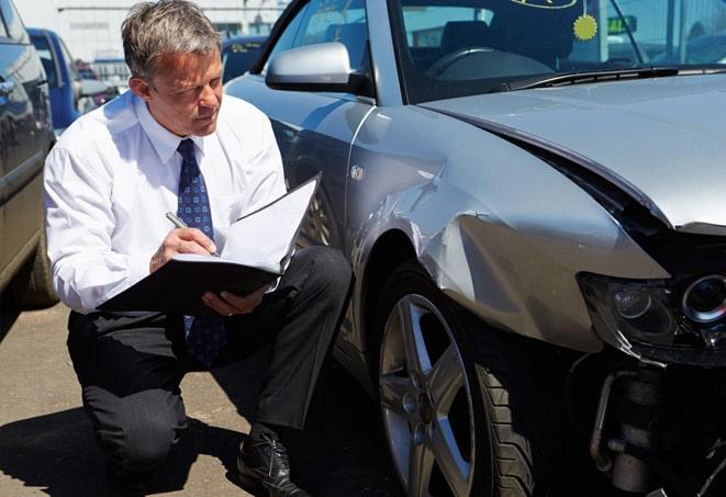 man reviewing auto insurance policy on tablet